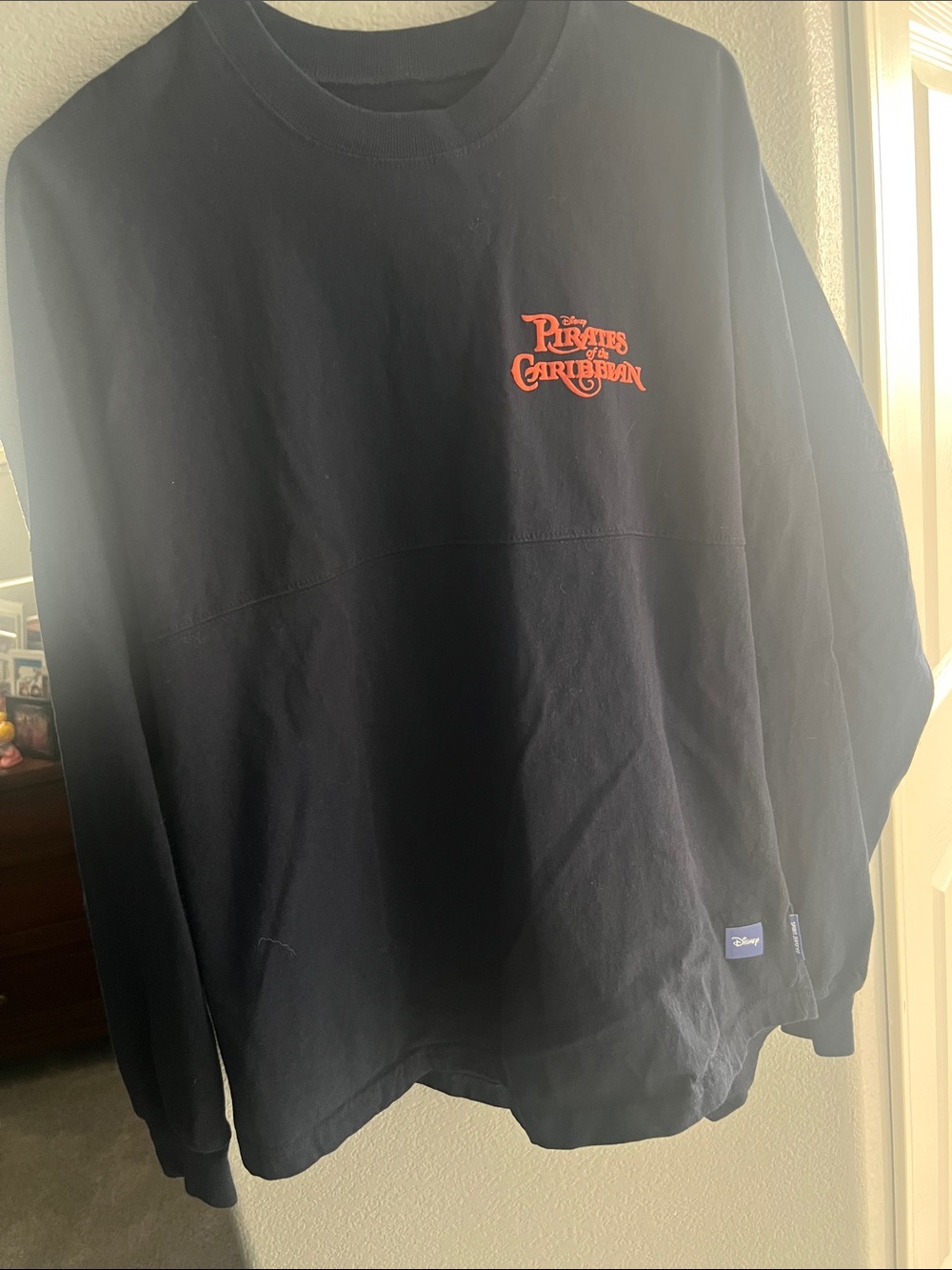 Disney Black Crewneck Sweatshirt with Red Pirates of the Caribbean Logo